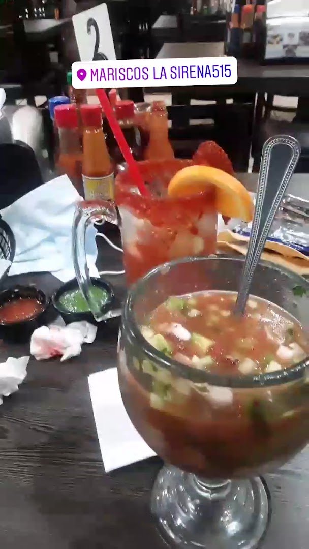 Shared plates beside drinks and napkins.