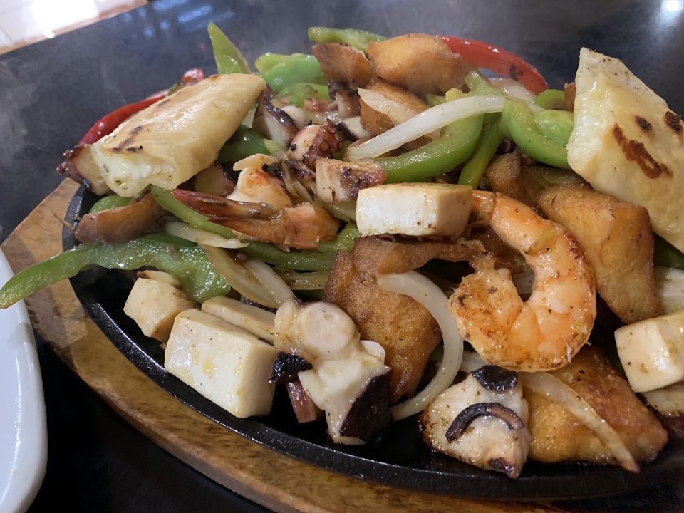 Seafood plates on a casual restaurant table.